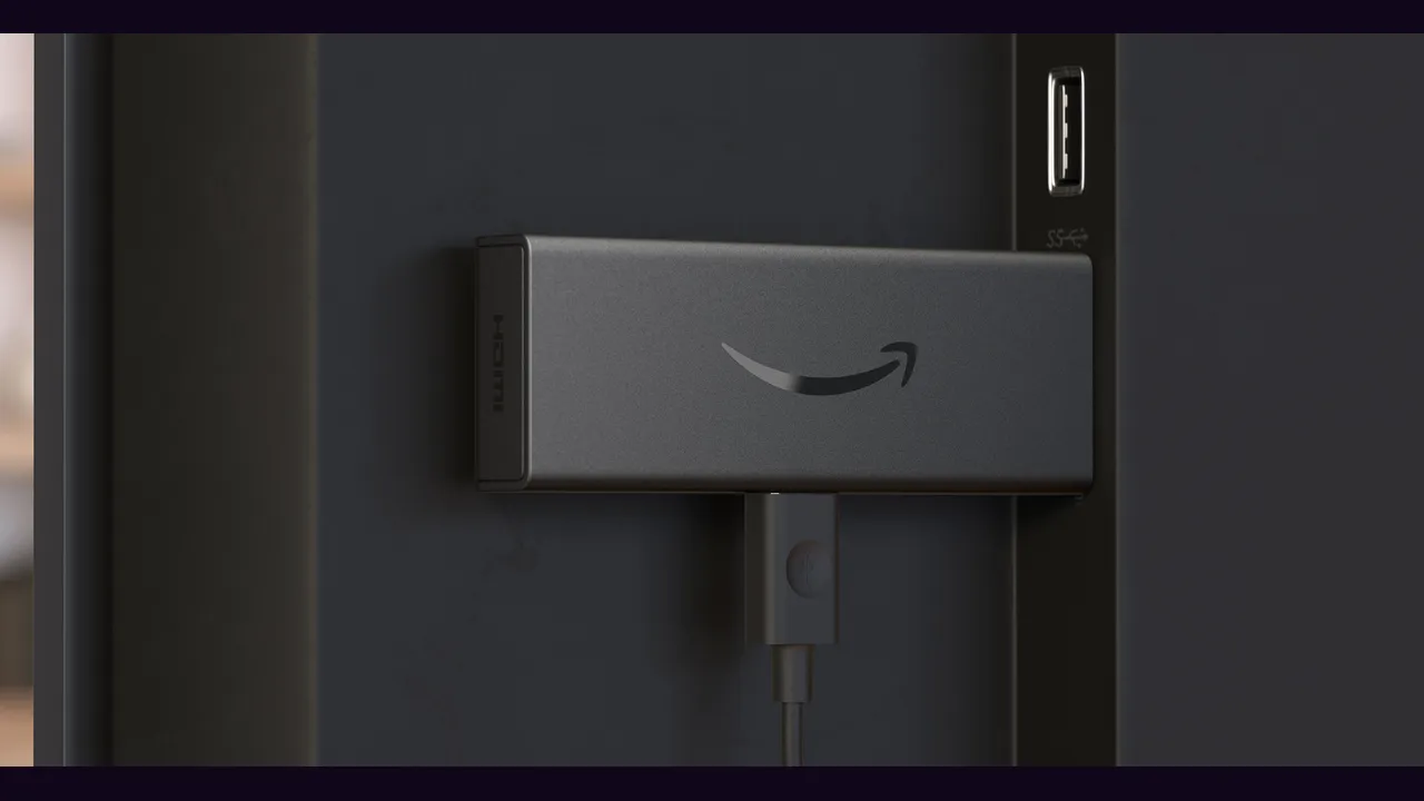 A streaming stick plugged into the back of a television